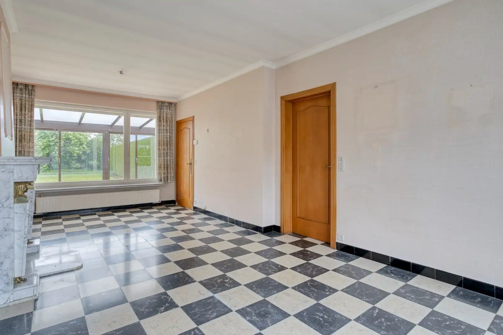 Te renoveren woning met garage en tuin in het centrum van Wevelgem! foto 4