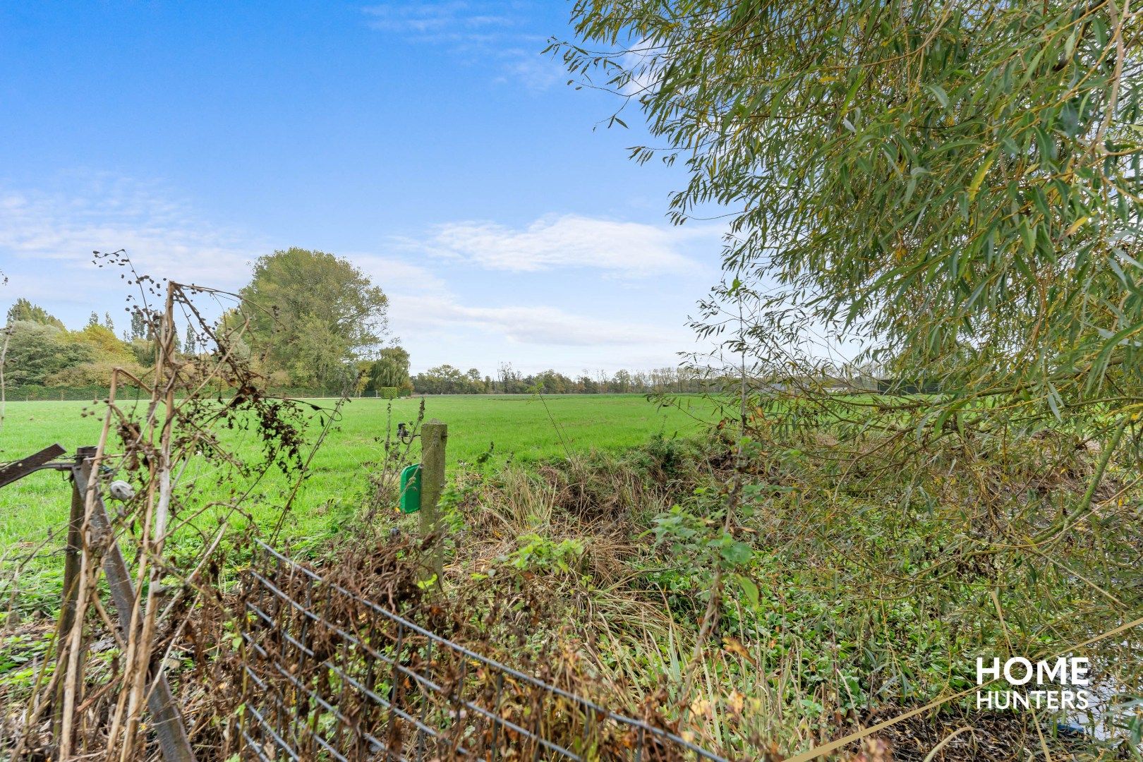 Halfopen gezinswoning met 3 slpks, carport en diepe tuin in Dikkebus foto 8