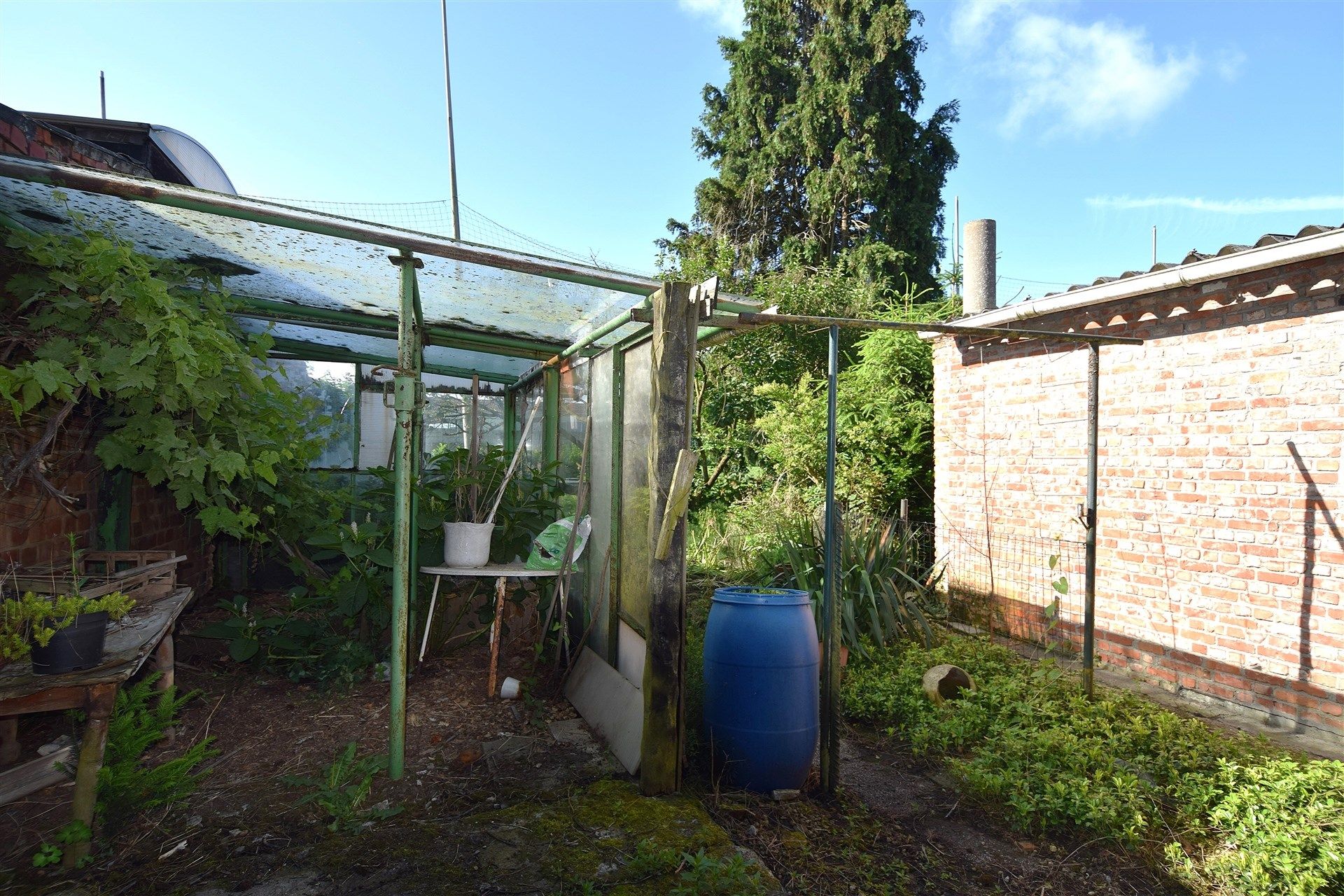 Uitstekend gelegen renovatiewoning met zonnige tuin en grote garage op 472m² foto 21