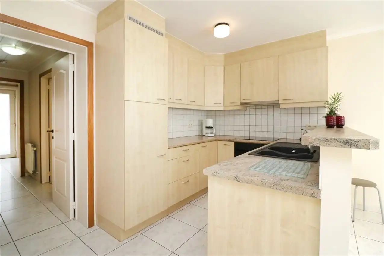 Gelijkvloers wonen met tuintje en autostaanplaats in centrum foto 12