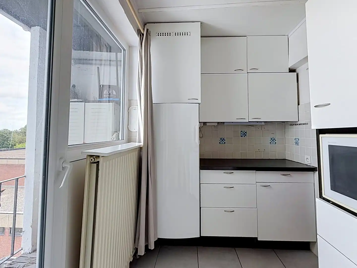 Ruim appartement met zonnig terras, uitzonderlijk ruime garage en kelderberging op wandelafstand van de Grote Markt van Tienen foto 10