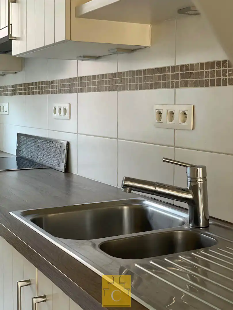 Instapklare trapgevelwoning met zonnig terrastuintje en grote berging, centrum, rustige straat omgeving ’t Zand foto 10