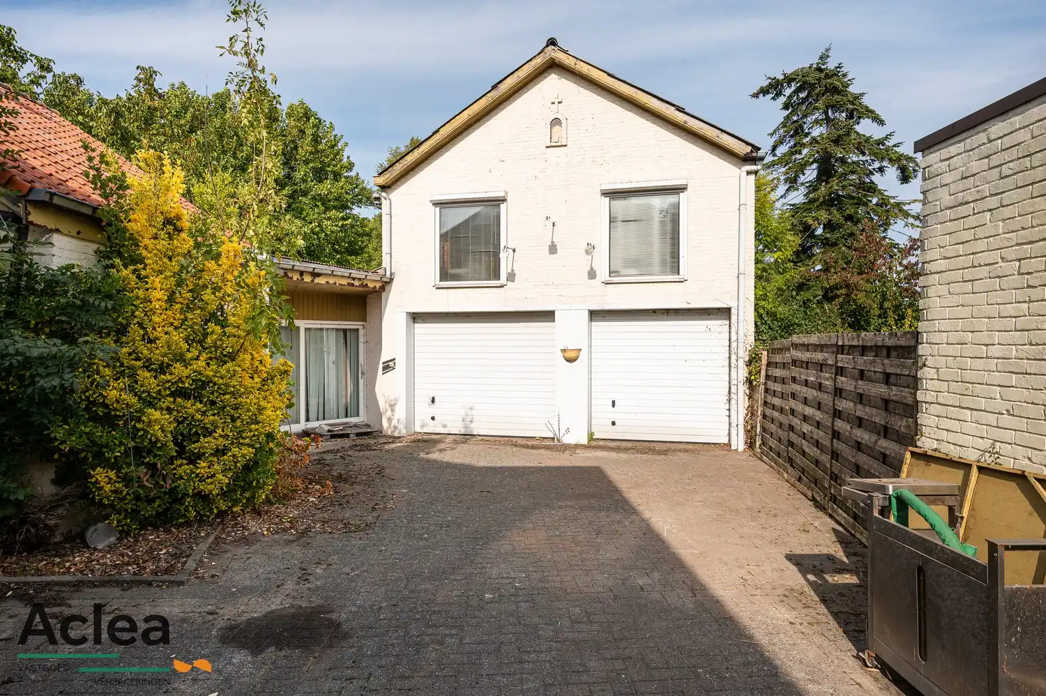 Te renoveren woning met grote magazijnruimte en veel potentieel foto 6