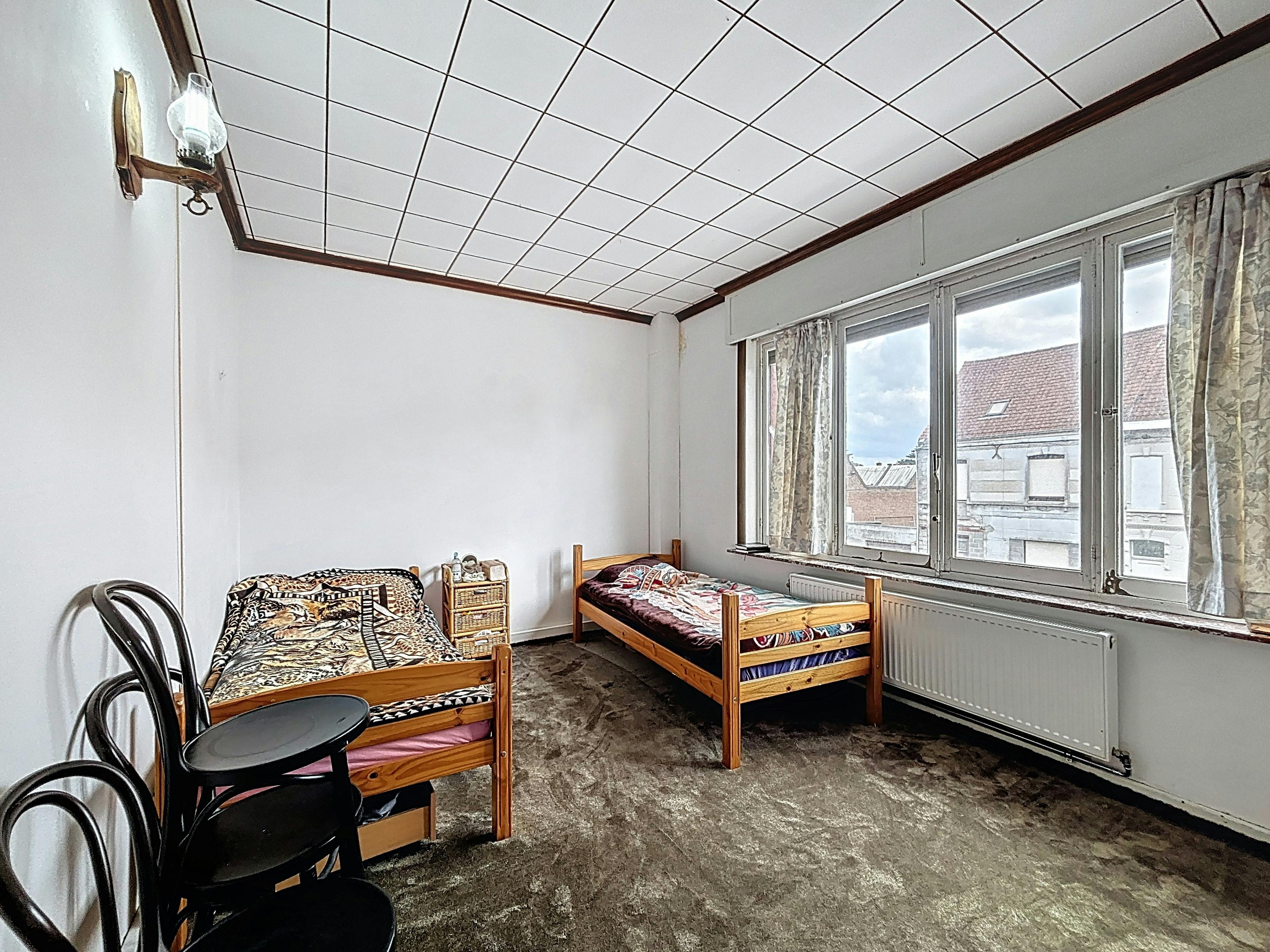 Te renoveren woning te koop in Kortrijk!  foto 11