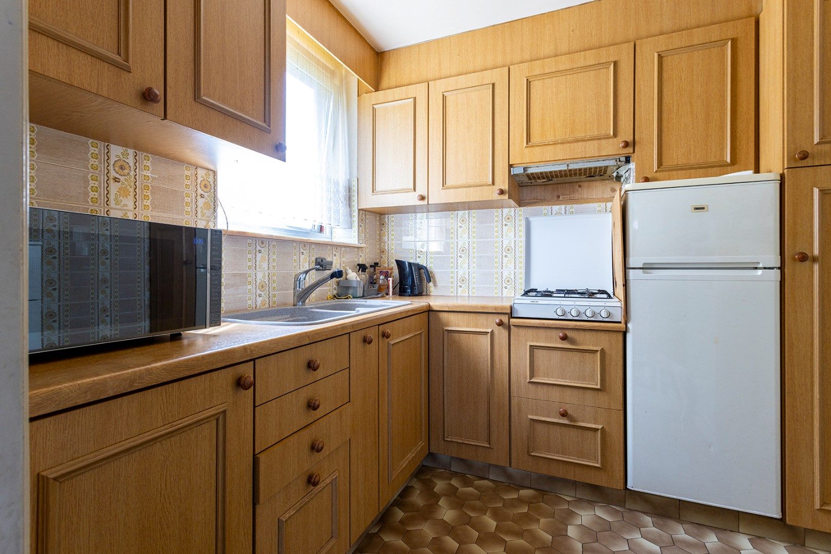 Gelijkvloers 2 slpk appartement met koer! foto 4