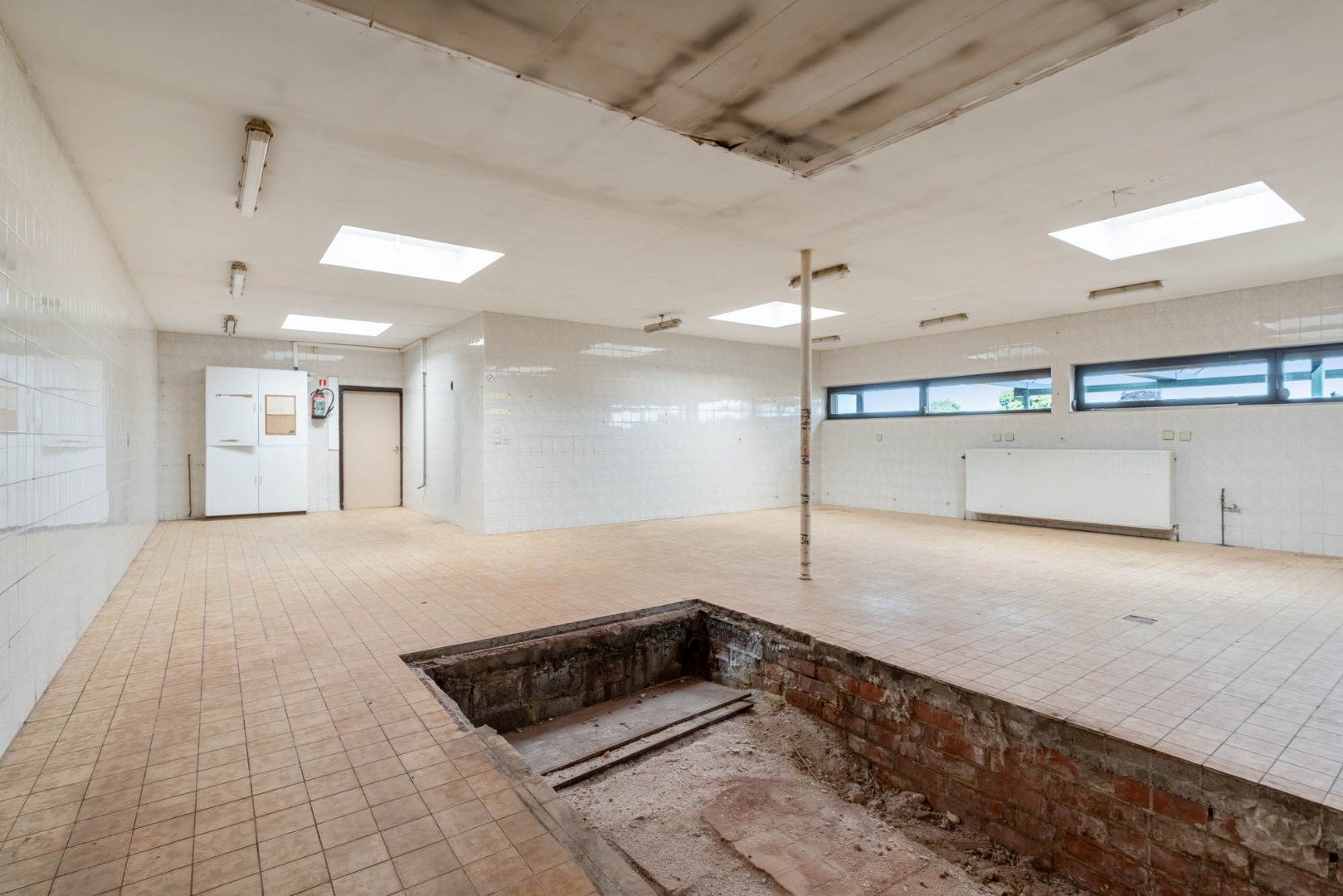 Multifunctioneel gebouw bestaande uit een woning, een winkel en een magazijn/werkplaats gelegen op een rustige locatie te Voorshoven! foto 29