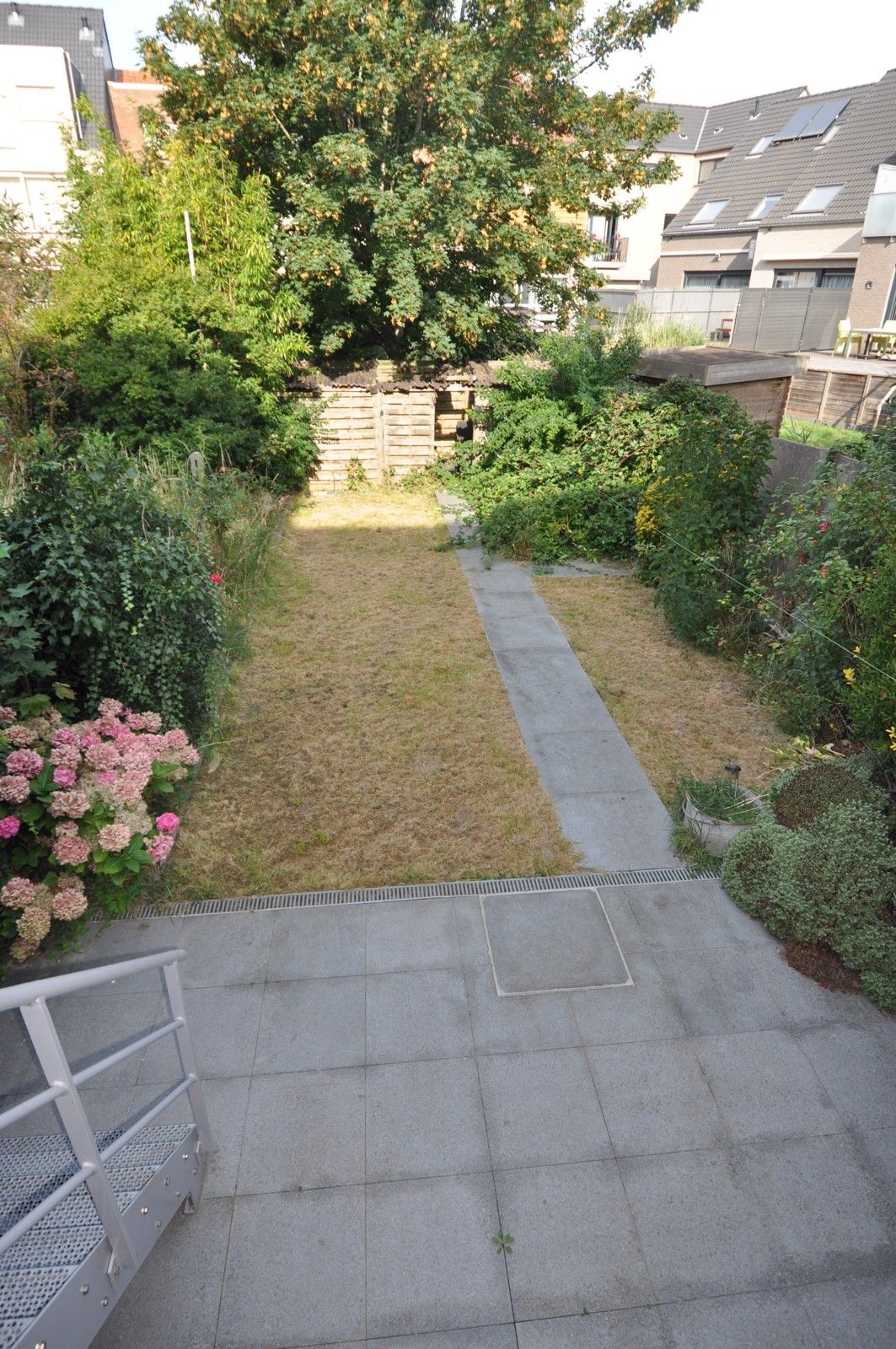 Ruime woning met veel potentieel en grote tuin ! foto 18