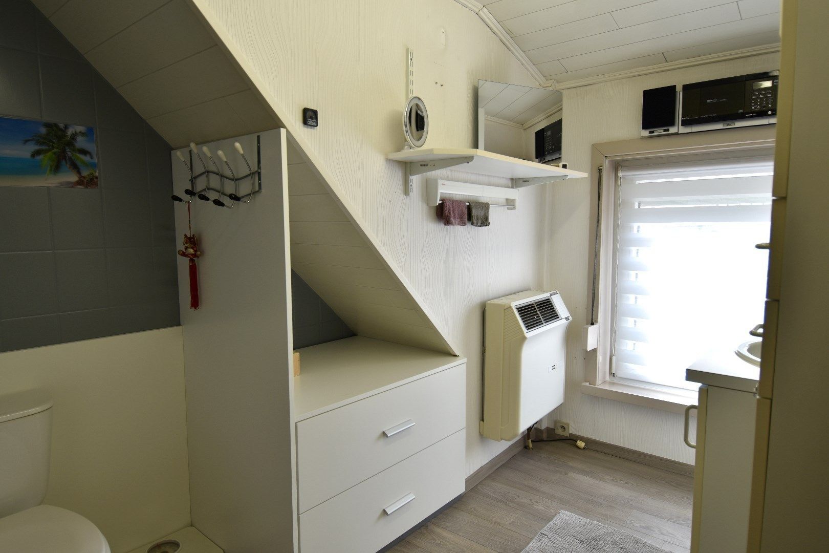 Mooie rijwoning met 2 slaapkamers, tuin en garage te koop in het gezellige Gullegem foto 9