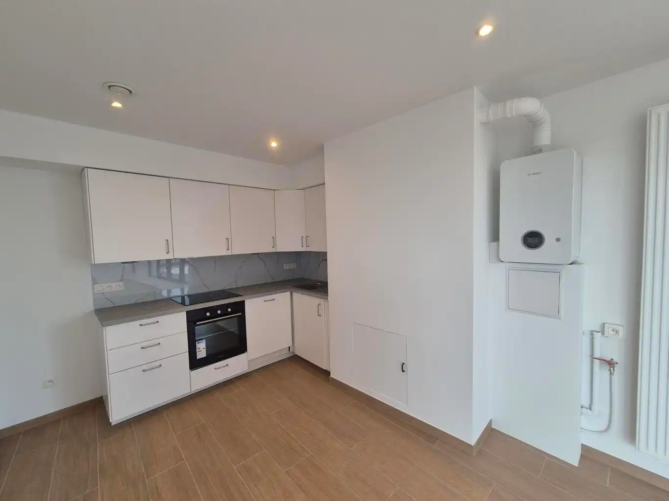 Nieuwbouw duplex met 2 slpks, bureel, terras en kelder foto 4