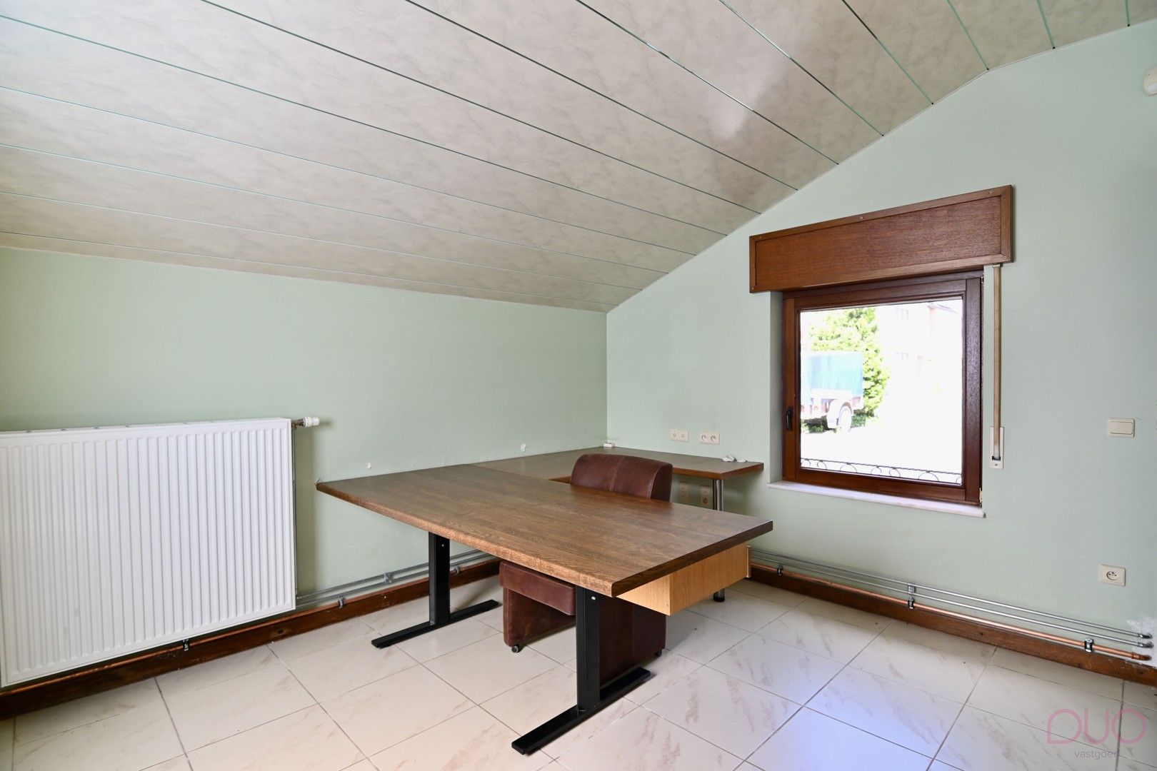 Gelijkvloerse  woning met 1 slaapkamer (optioneel 2) met achterliggend 2 garages nabij het centrum van Tongeren foto 4