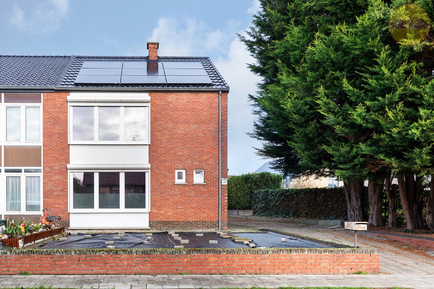 Energiezuinige halfopen gezinswoning met 3 slaapkamers, tuin en garage in Tessenderlo-Ham foto {{pictureIndex}}