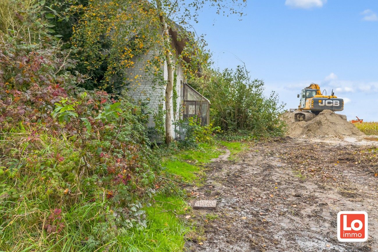 Afbraakwoning op mooi zuid georiënteerd perceel bouwgrond met open zicht in Lochristi! foto 5