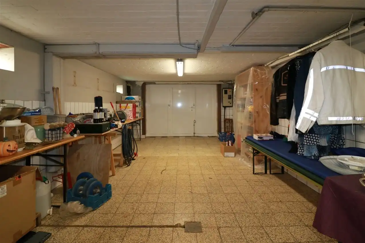 Gusting gelegen woning met 2 slpk, garage en tuin foto 27