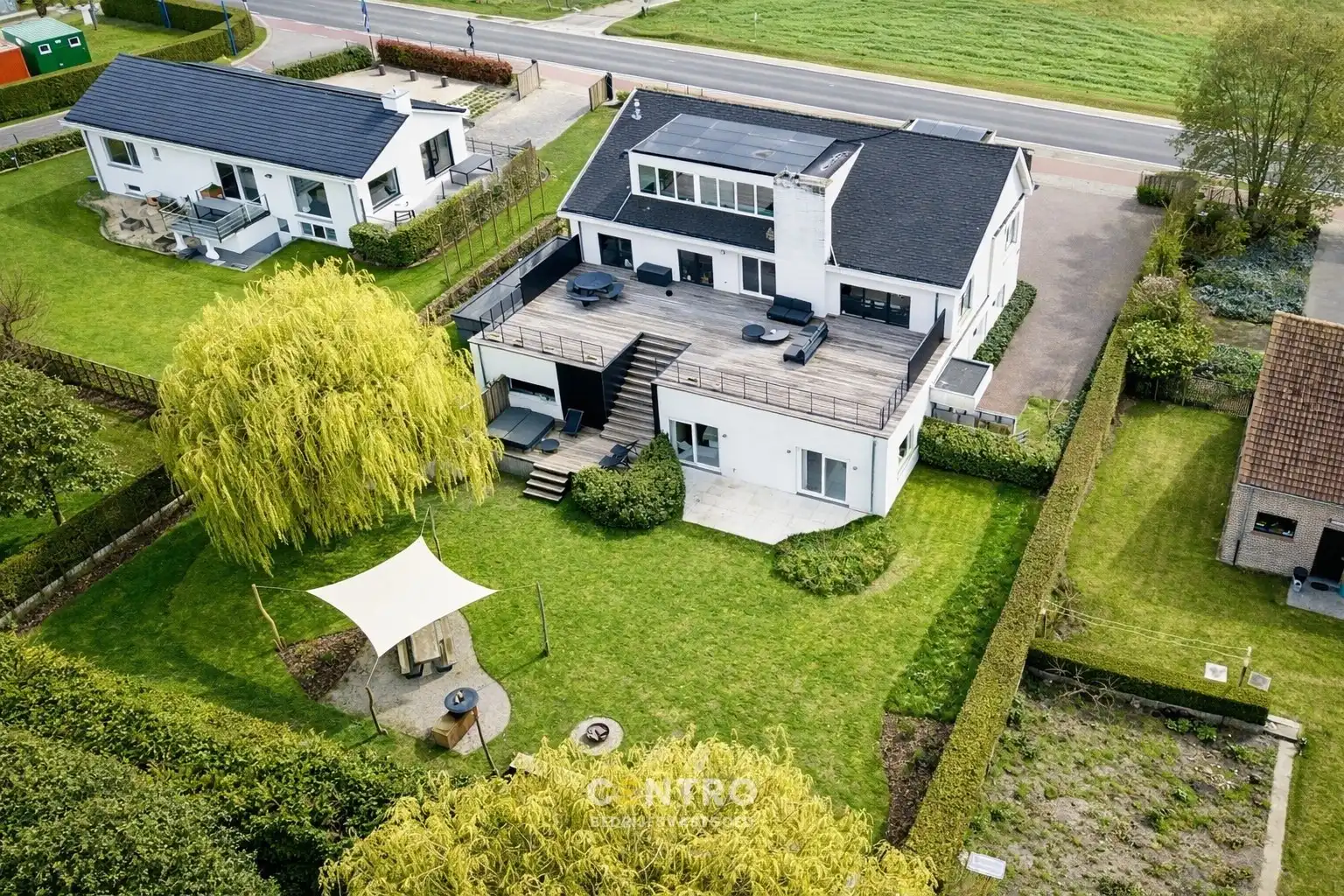 Modern en instapklaar WOON-WERKPAND met professionele ruimten, lichtrijk & ruim APPARTEMENT met zonneterras en aangelegde tuin. foto 2