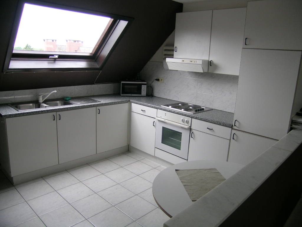 Knus 1 slaapkamer appartement te koop in het centrum van Maasmechelen, ideaal als investering! foto 3