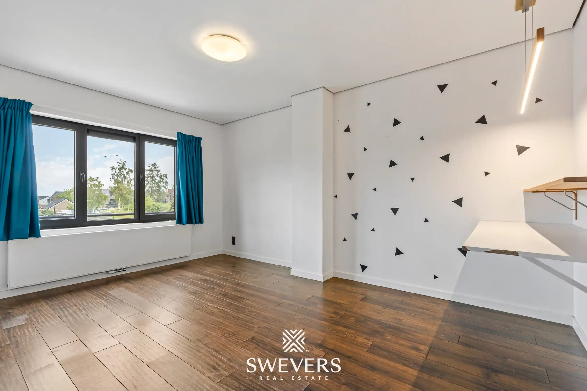 Instapklare en energiezuinige rijwoning met tuin, terras en garage in hartje Leopoldsburg foto 17