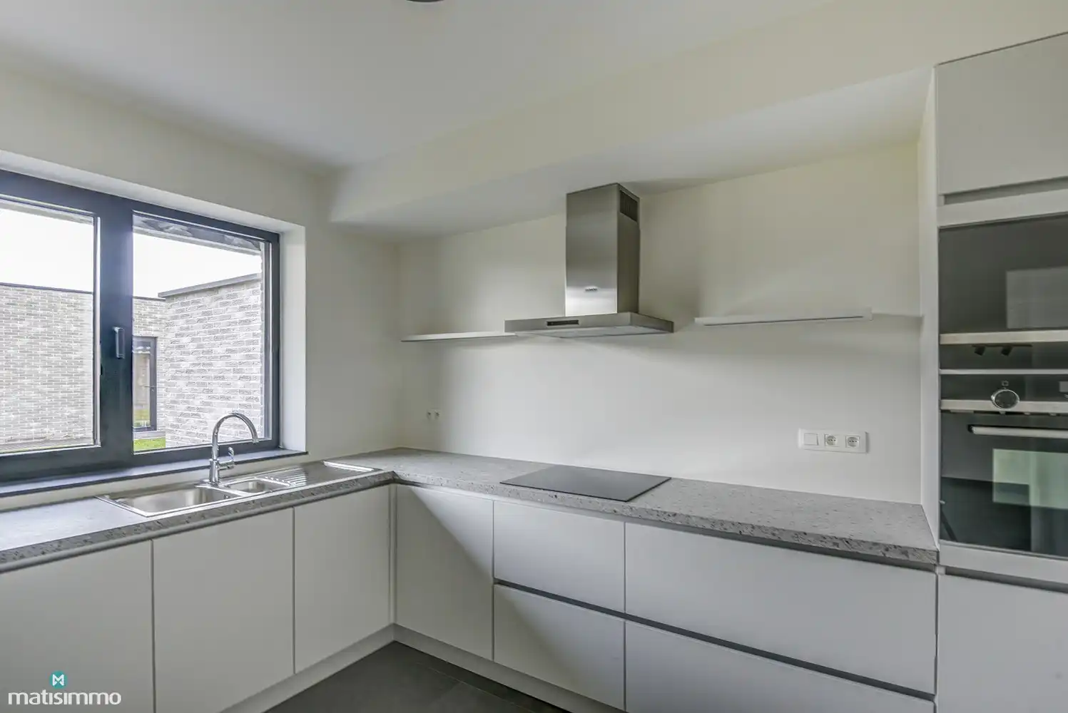 RUIM NIEUWBOUW APPARTEMENT MET 2 SLAAPKAMERS, TERRAS, GARAGE, AUTOSTAANPLAATS EN KELDERBERGING TE BEVERST foto 9