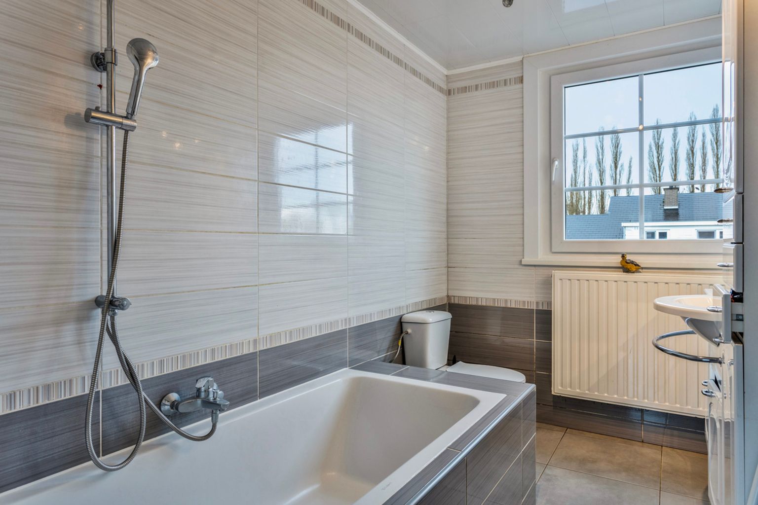 immo DAVID stelt voor: 3-gevel woning foto 13