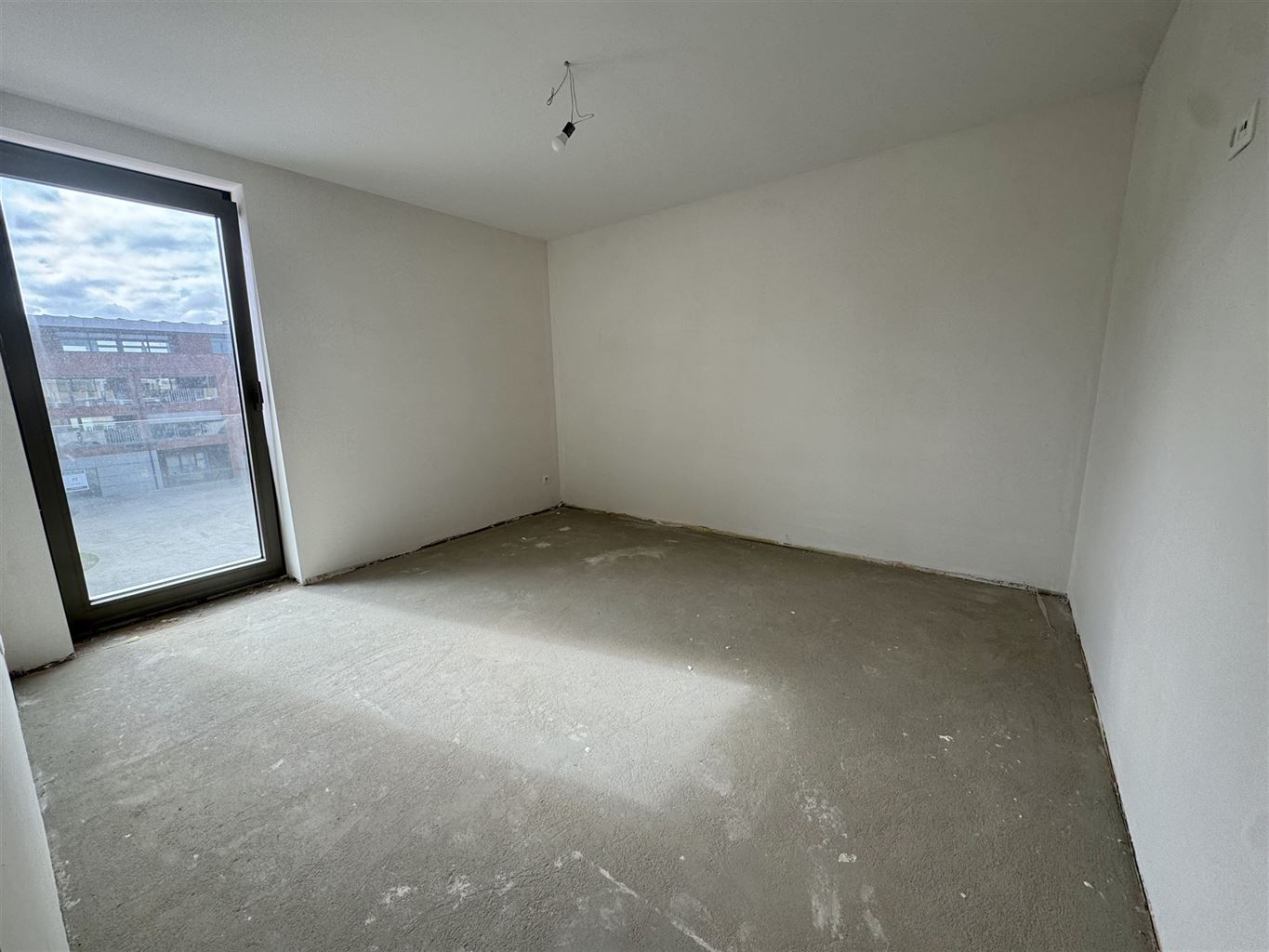 Nieuwbouwappartement op de tweede verdieping met 2 slaapkamers en terras gelegen in het centrum van Dilsen.  foto 9