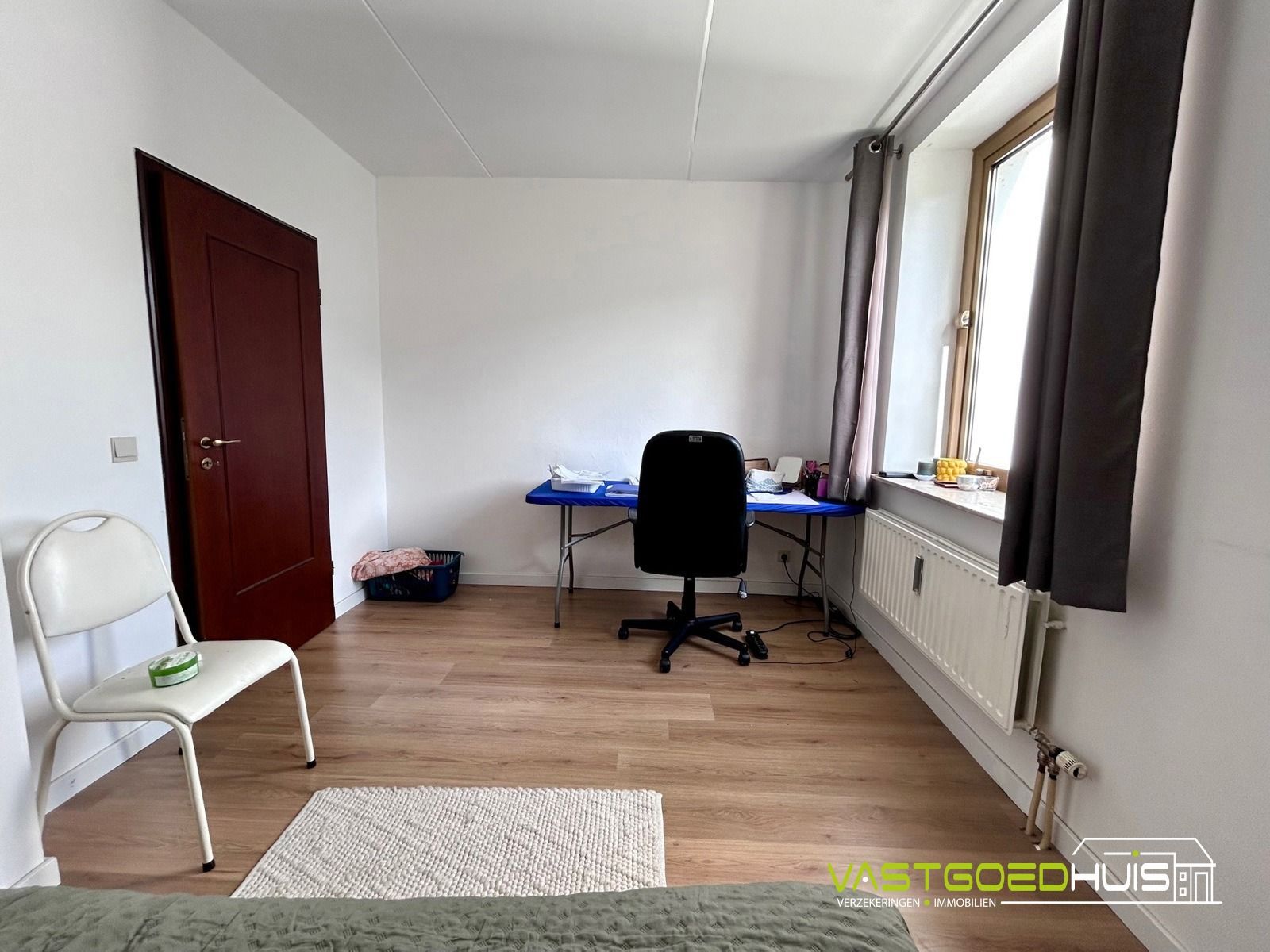 Ruim, gelijkvloers appartement met terras foto 17