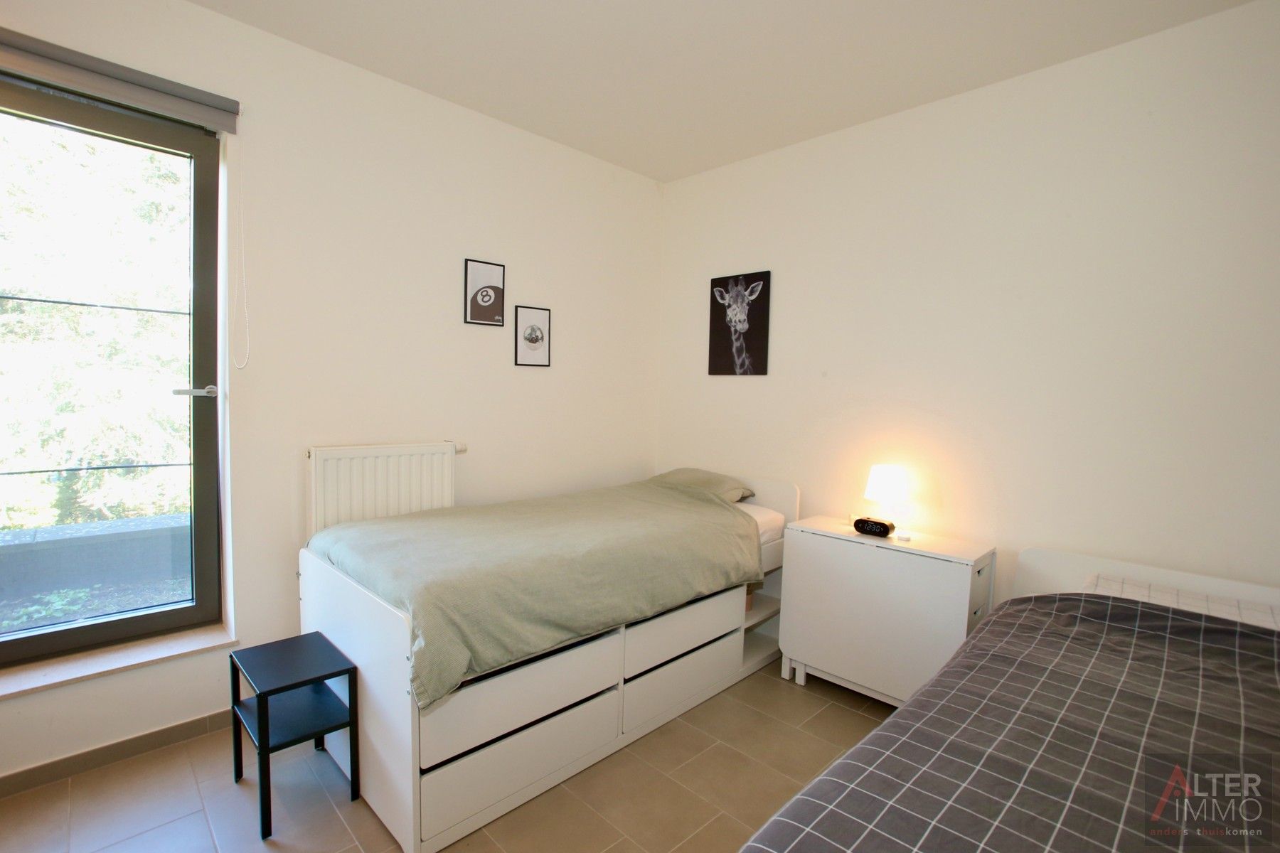 Instapklaar, centraal gelegen 2-slaapkamer appartement met terras en ondergrondse parking! foto 13
