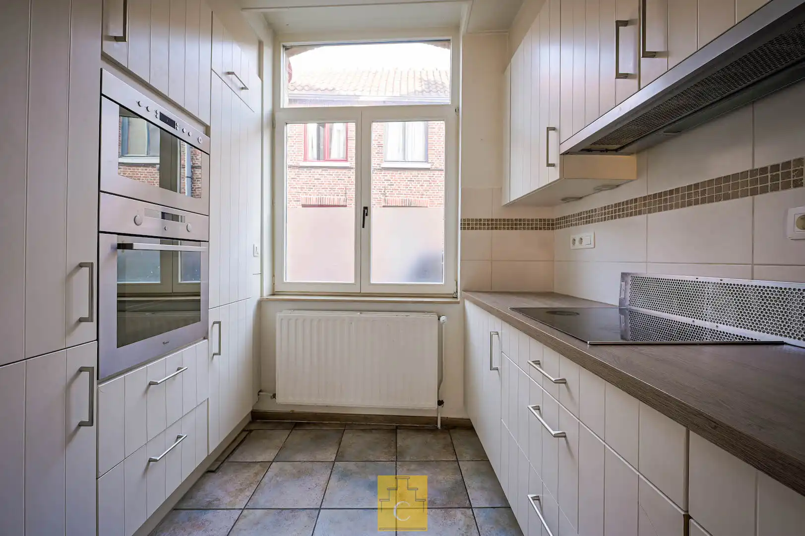 Instapklare trapgevelwoning met zonnig terrastuintje en grote berging, centrum, rustige straat omgeving ’t Zand foto 12