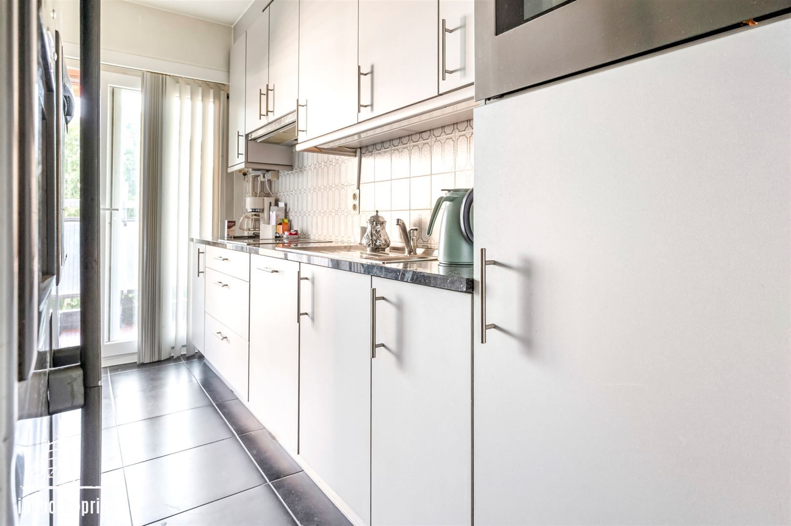 Goed onderhouden verhuurd appartement  met 2 slaapkamers foto 9