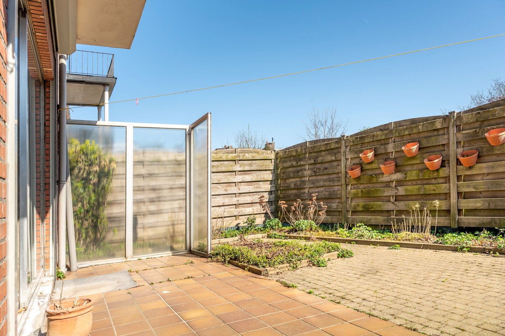 Gelijkvloers appartement met terras en garagebox! foto 16