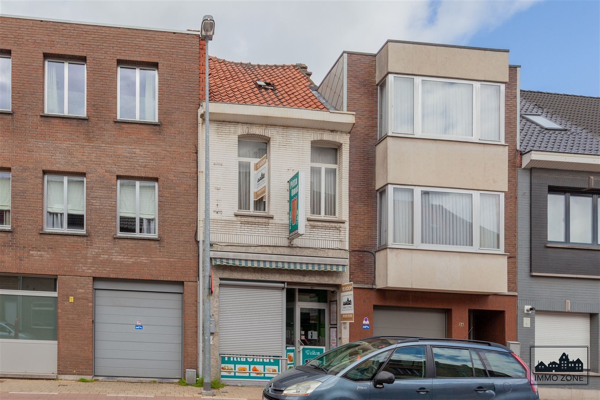 Gunstig gelegen rijwoning met handelsruimte foto 1