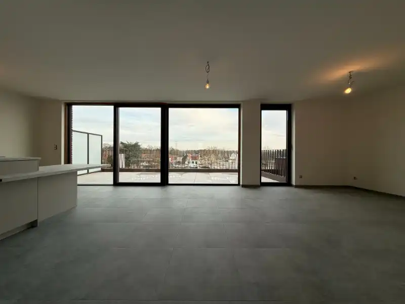 Prachtig BEN-penthouse met 1 slpk, terras, parking én zonnepanelen in het centrum van Houthalen foto 2