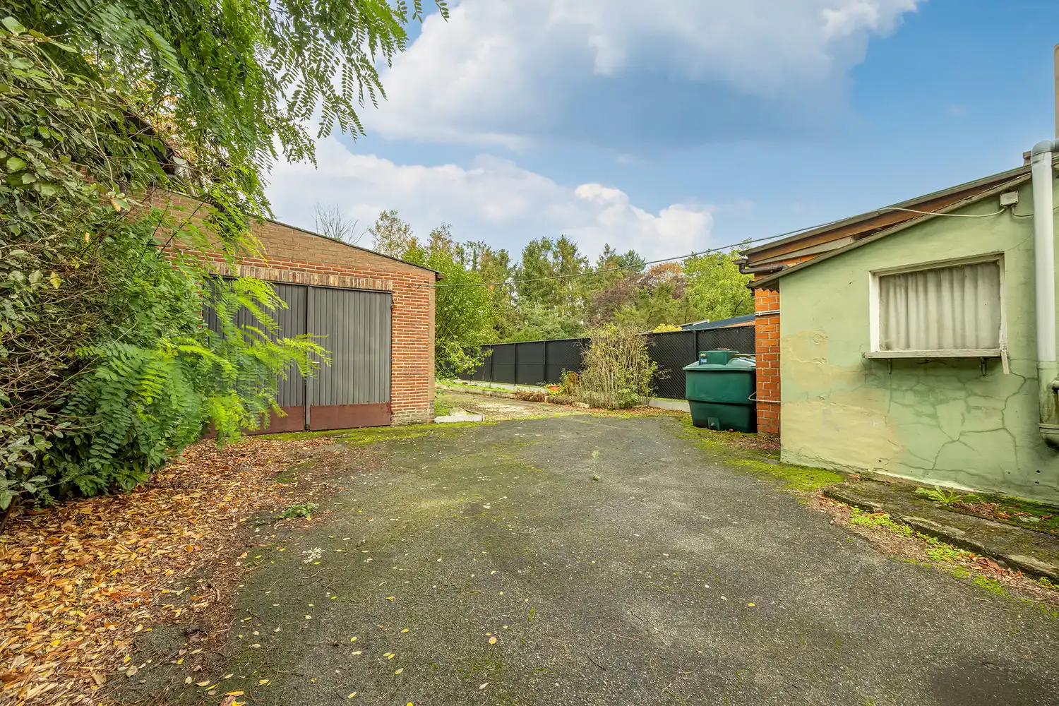 Halfopen woning op 575 m² met garage, carport en diepe tuin – te renoveren foto 16