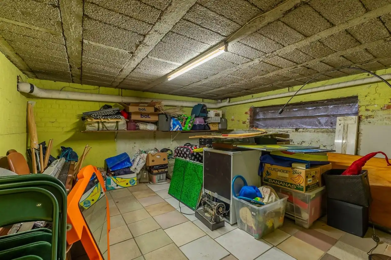 Ruime retrowoning met EPC C,  zuidtuin en achterliggende toegang. foto 25