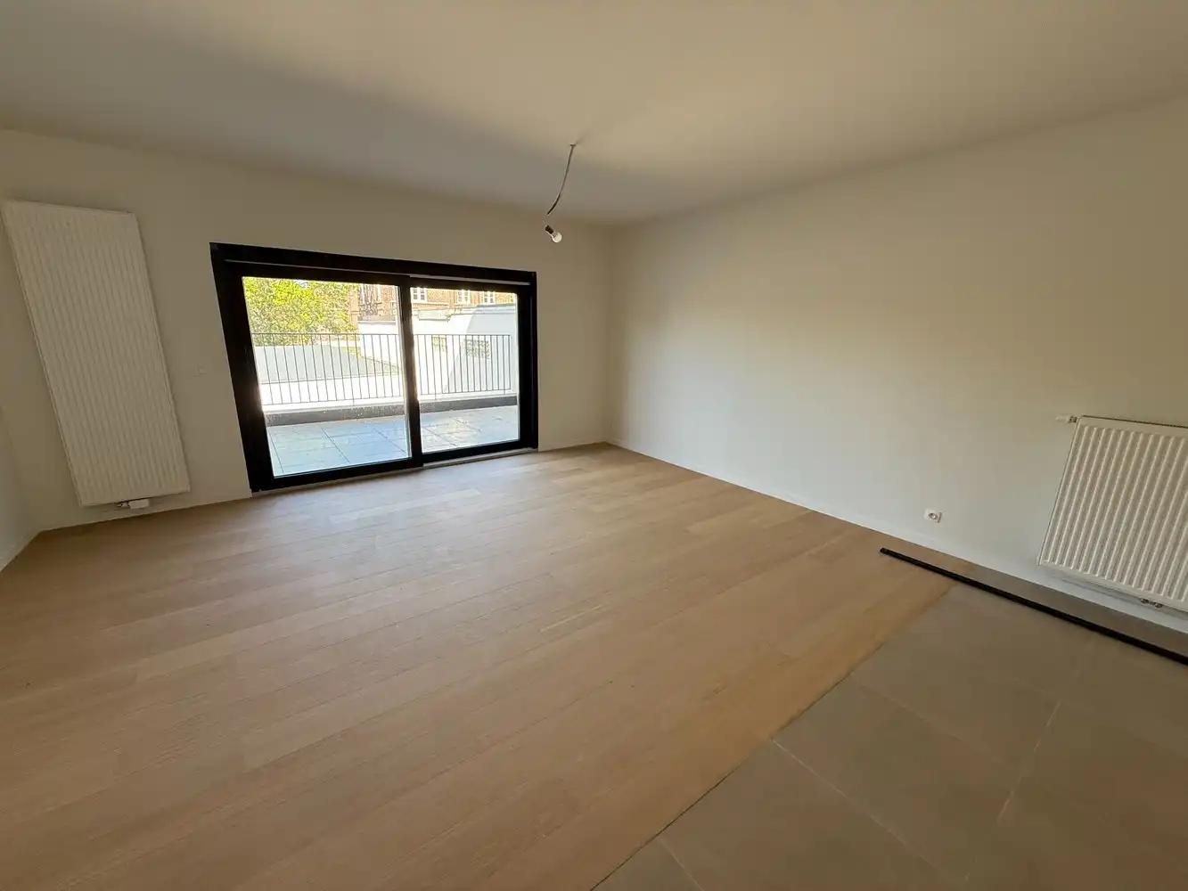 Ruim nieuwbouwappartement met 2 slaapkamers én parkeerplaats! foto 3