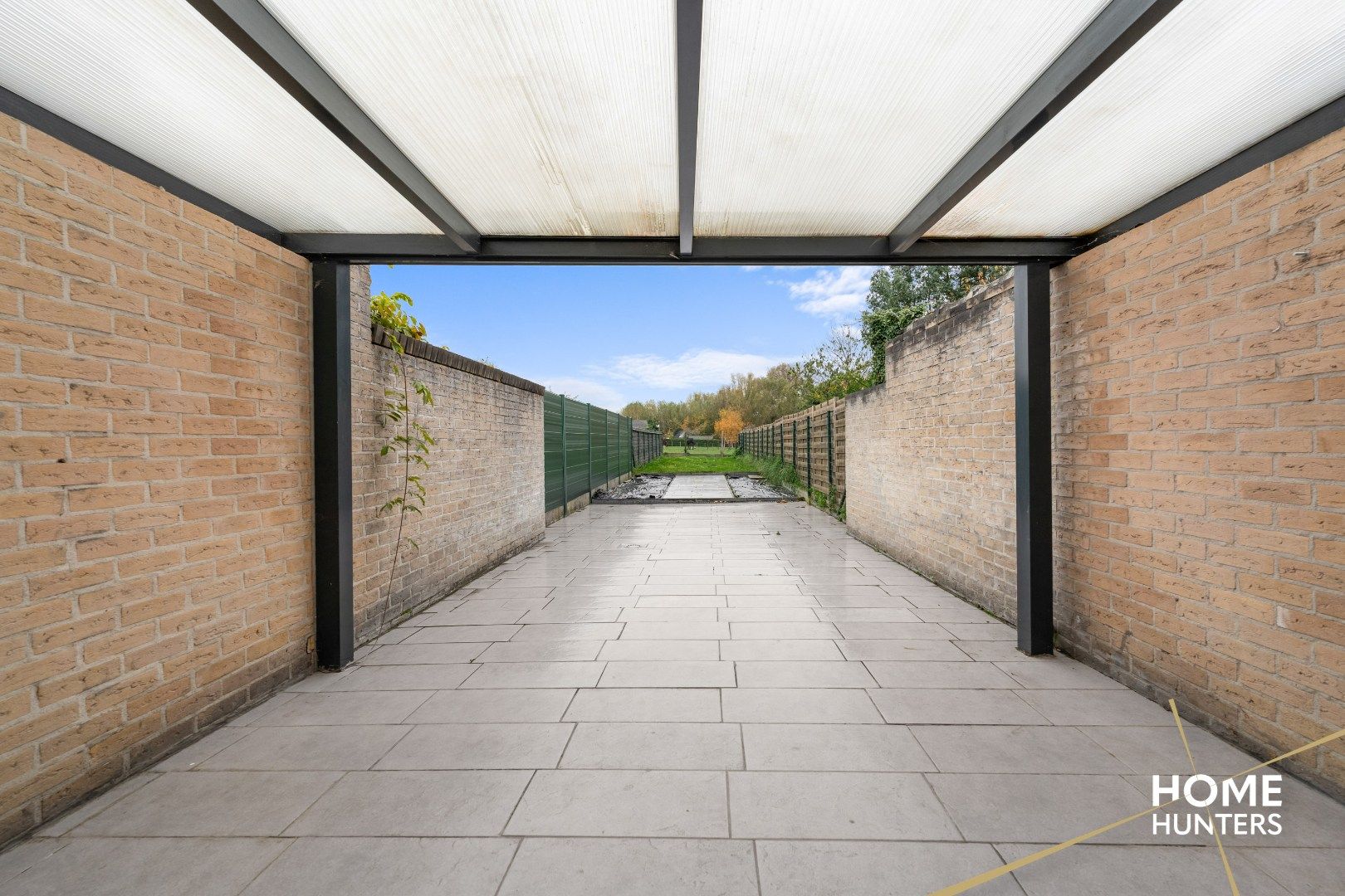 Charmante te renoveren rijwoning met 3 slaapkamers en diepe tuin op centrale ligging in Menen foto 23