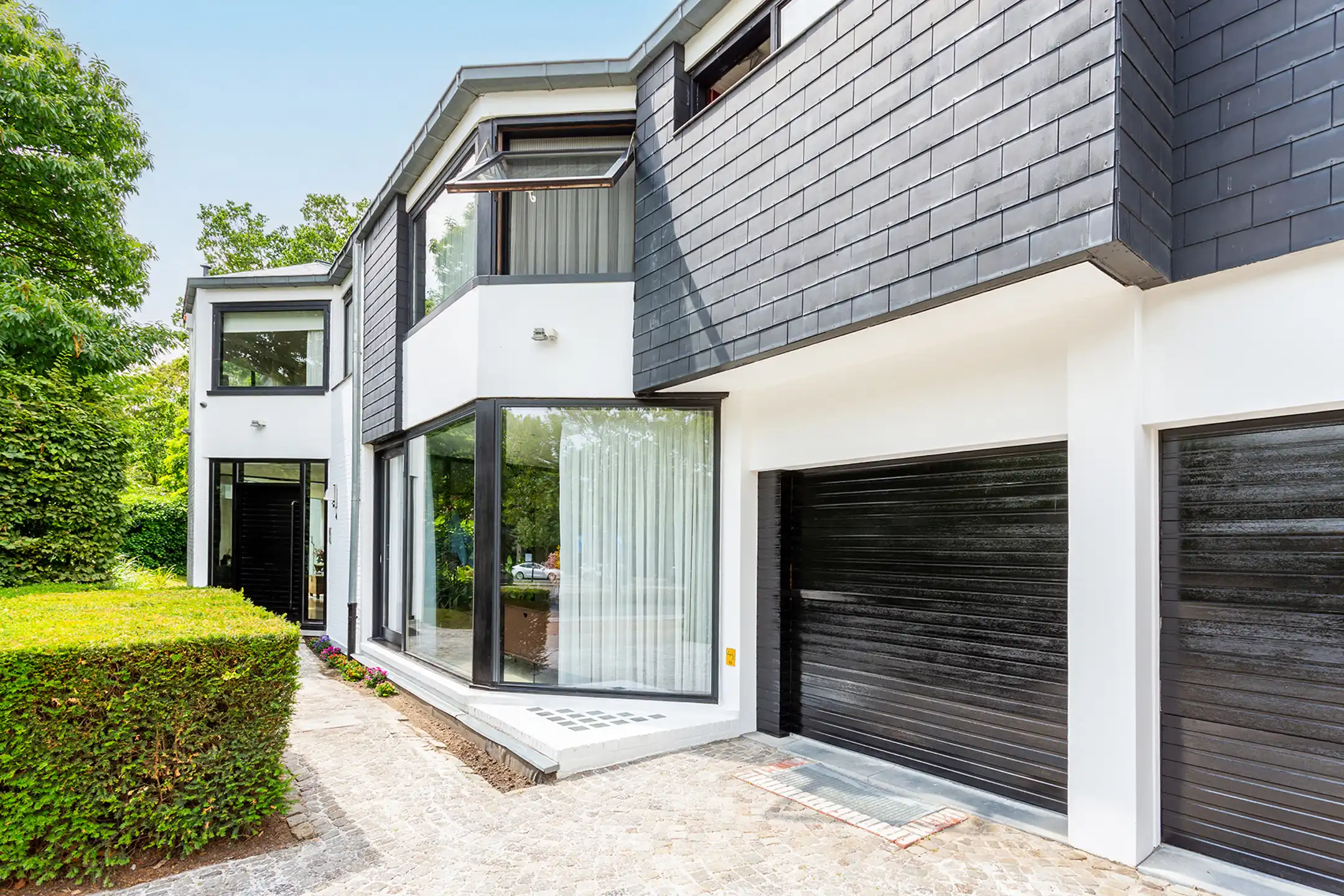 Topgelegen architectenwoning met ruim tuin en binnenzwembad. foto 51
