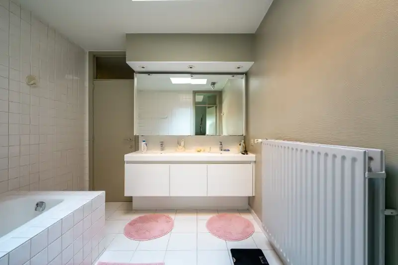 Unieke en ruime woning met geïntegreerd kantoor, 4 slpks en zuidgerichte tuin foto 19