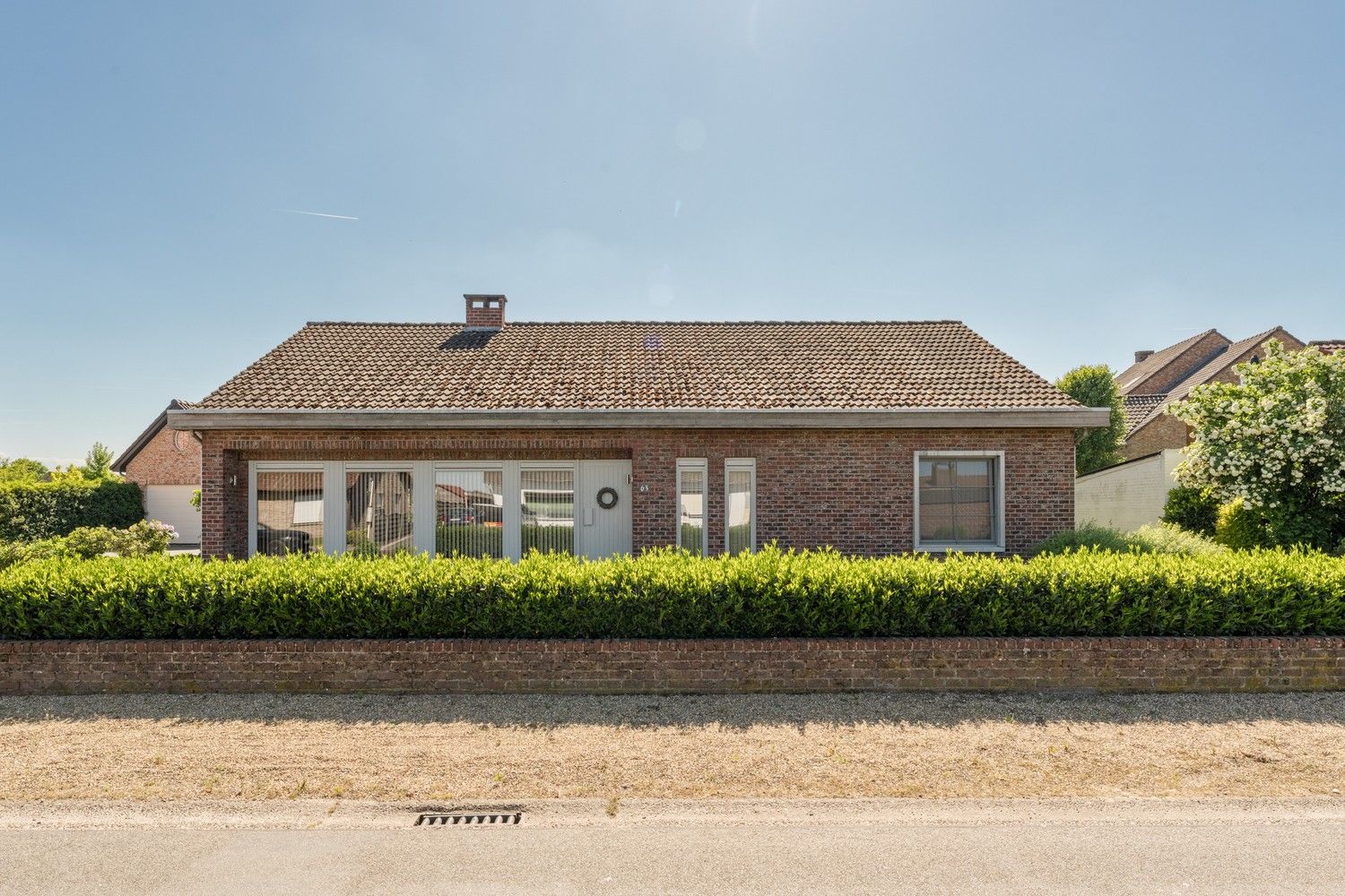 Gelijkvloerse 3 SLK woning op een mooi onderhoudsvriendelijk perceel foto 2