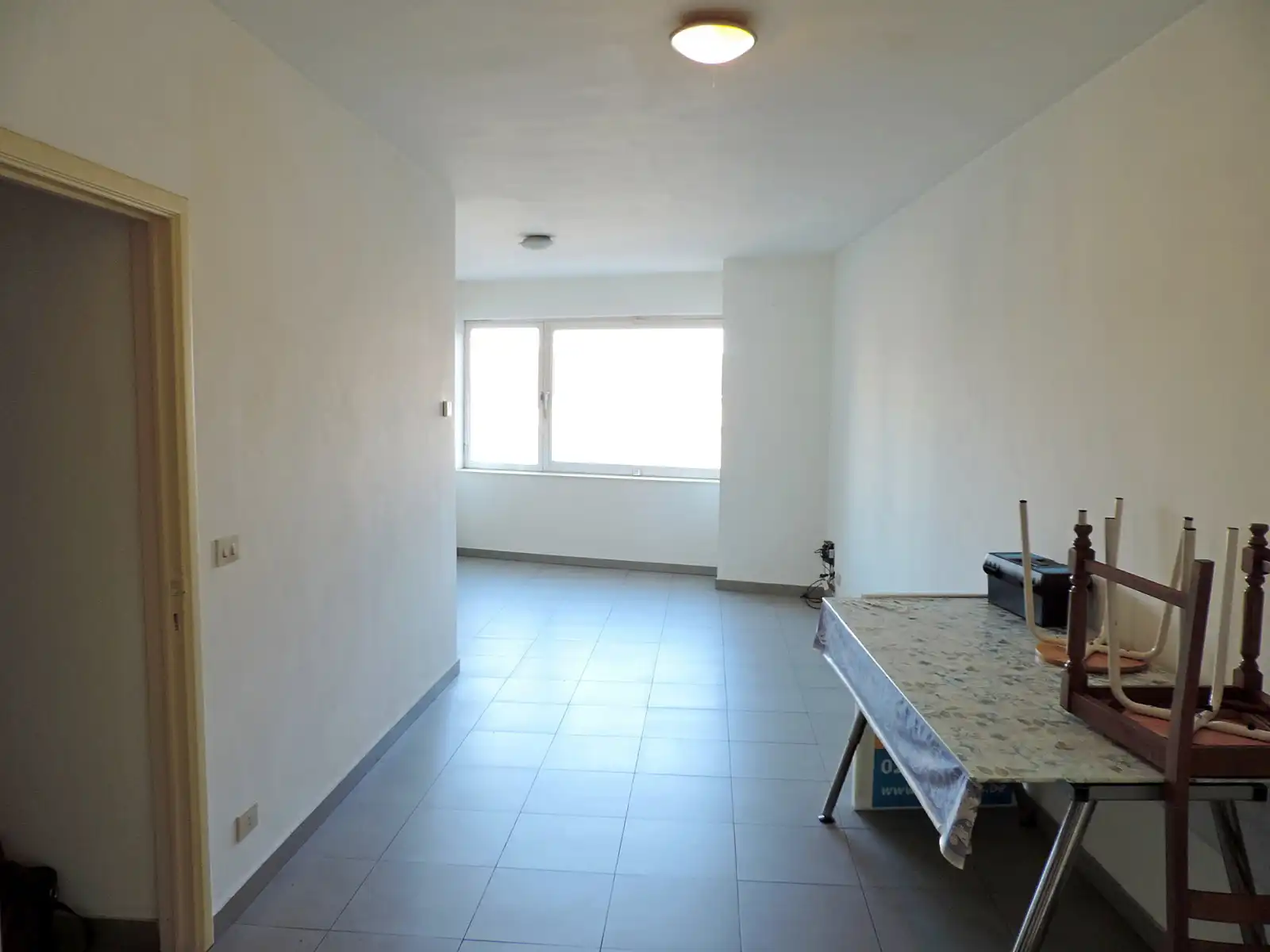 Opbrengsteigendom met handelsgelijkvloers en 2 appartementen foto 4