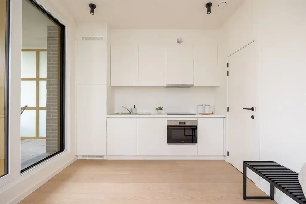 lichtrijk nieuwbouwappartement met terras foto 4