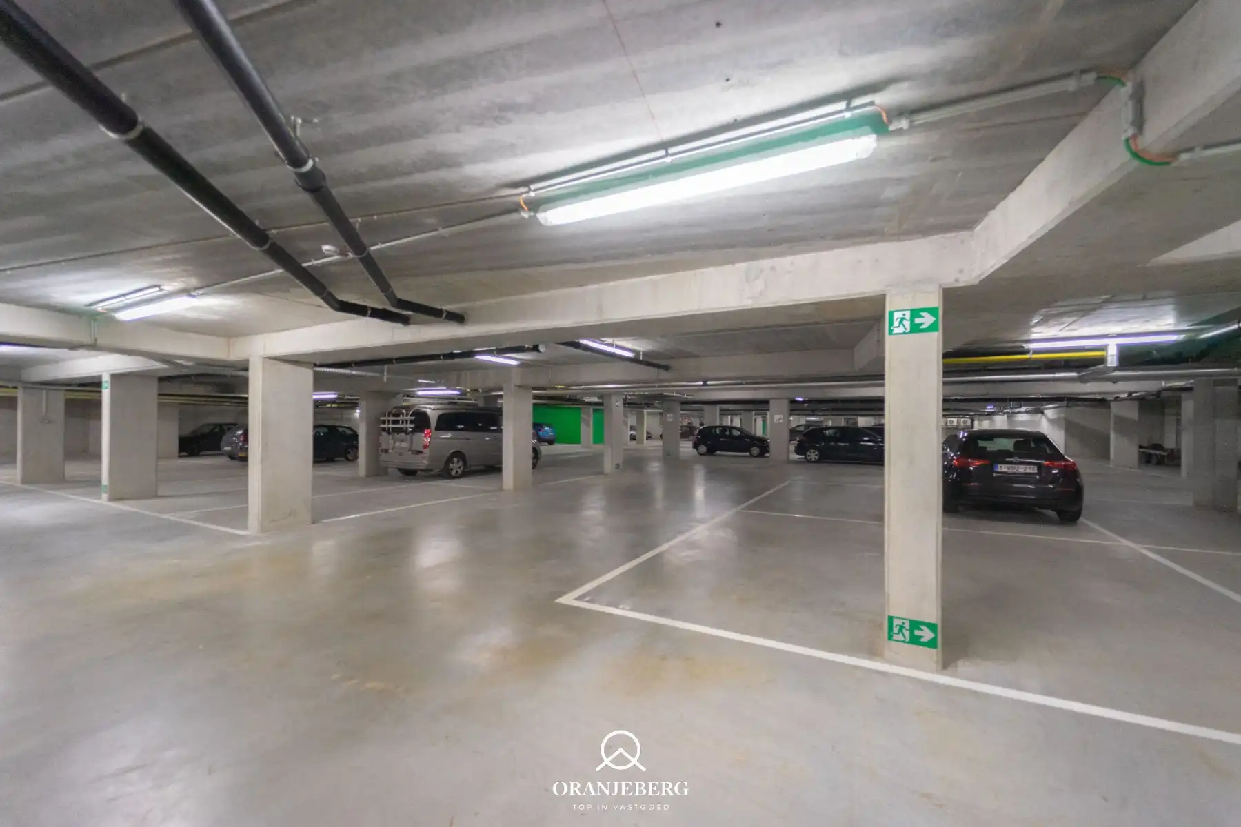 Nieuwbouw autostaanplaats te huur in afgesloten parkeergarage nabij Gent centrum foto 2