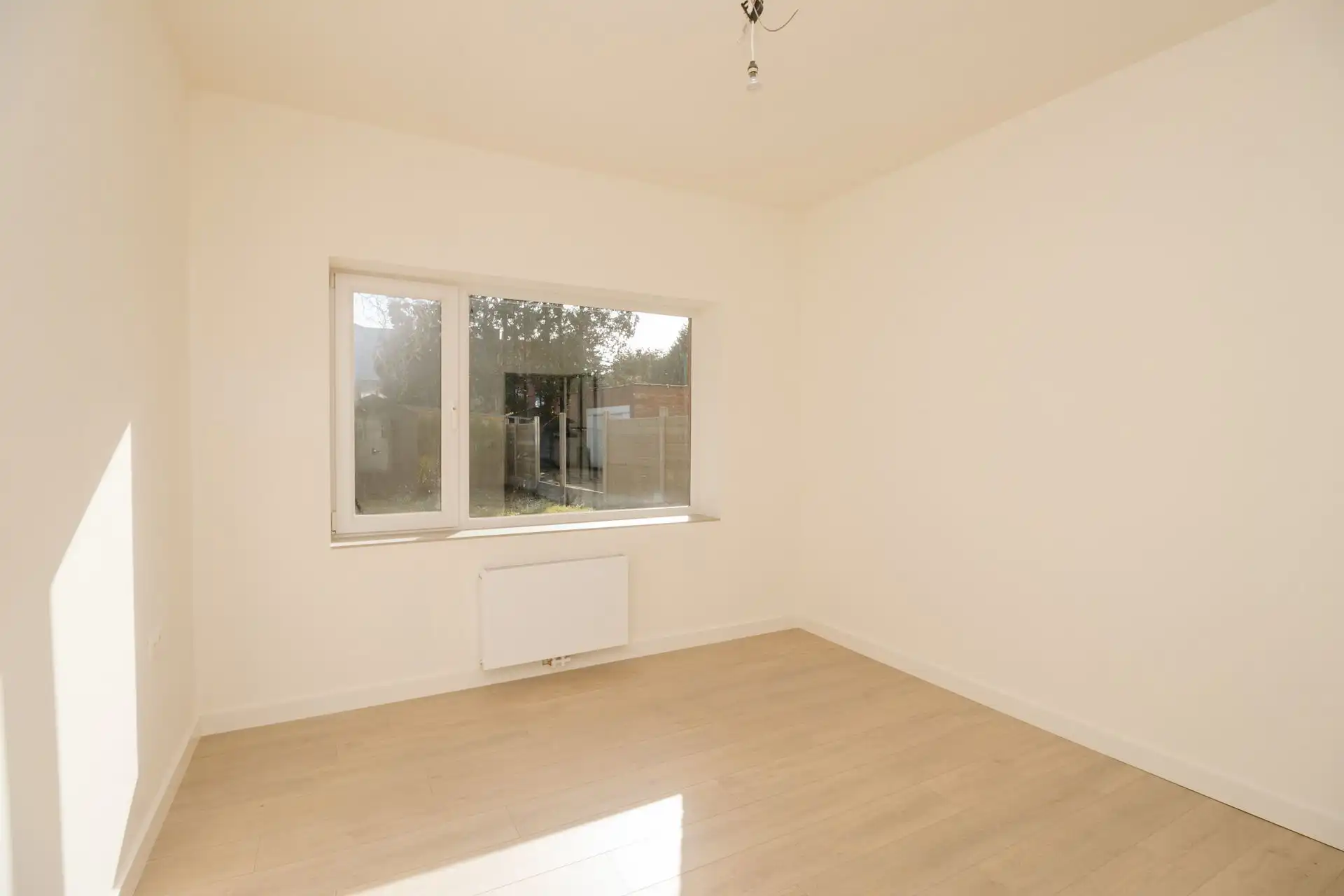 Gerenoveerd gelijkvloers appartement met tuin foto 11