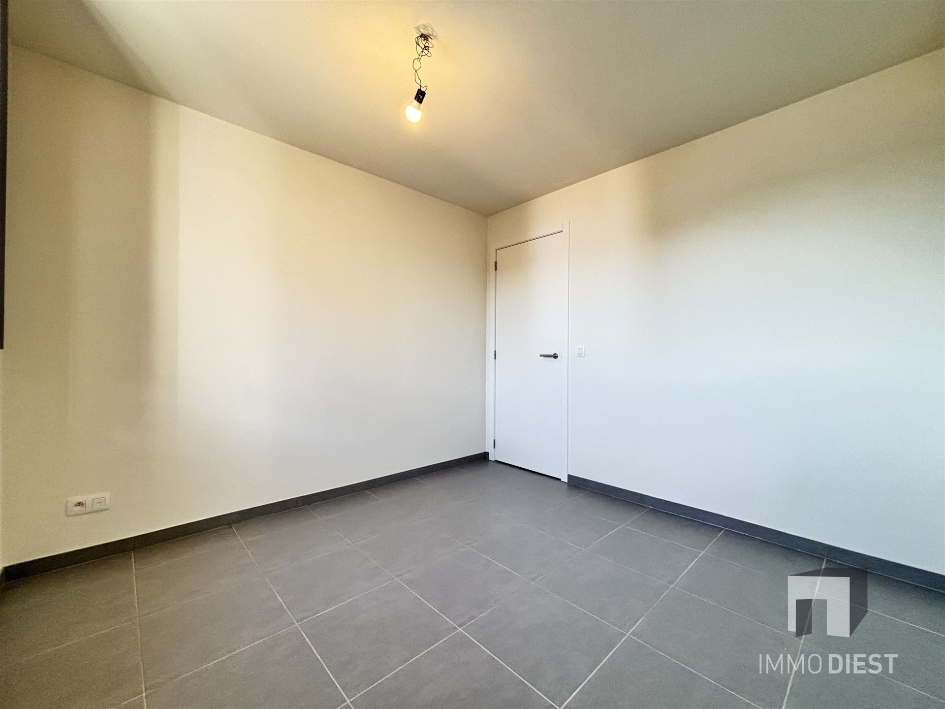 Ruim appartement op de tweede verdieping in het centrum van Tessenderlo foto 11