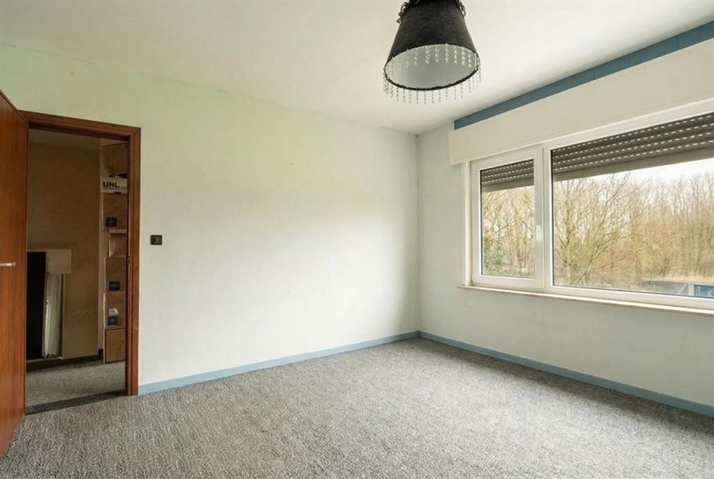 Te renoveren woning met achterliggend weiland foto 11