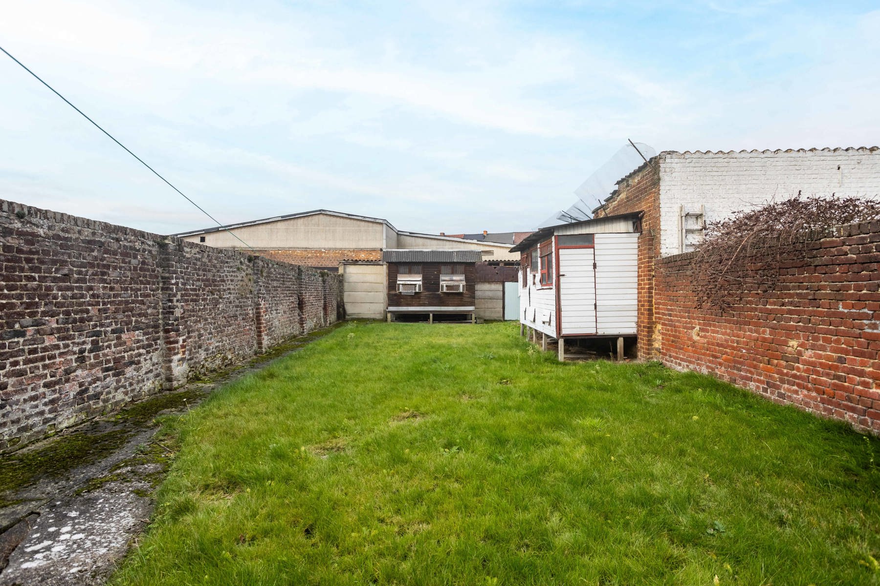 TE RENOVEREN RIJWONING MET TUIN EN GARAGEBOXEN foto 21