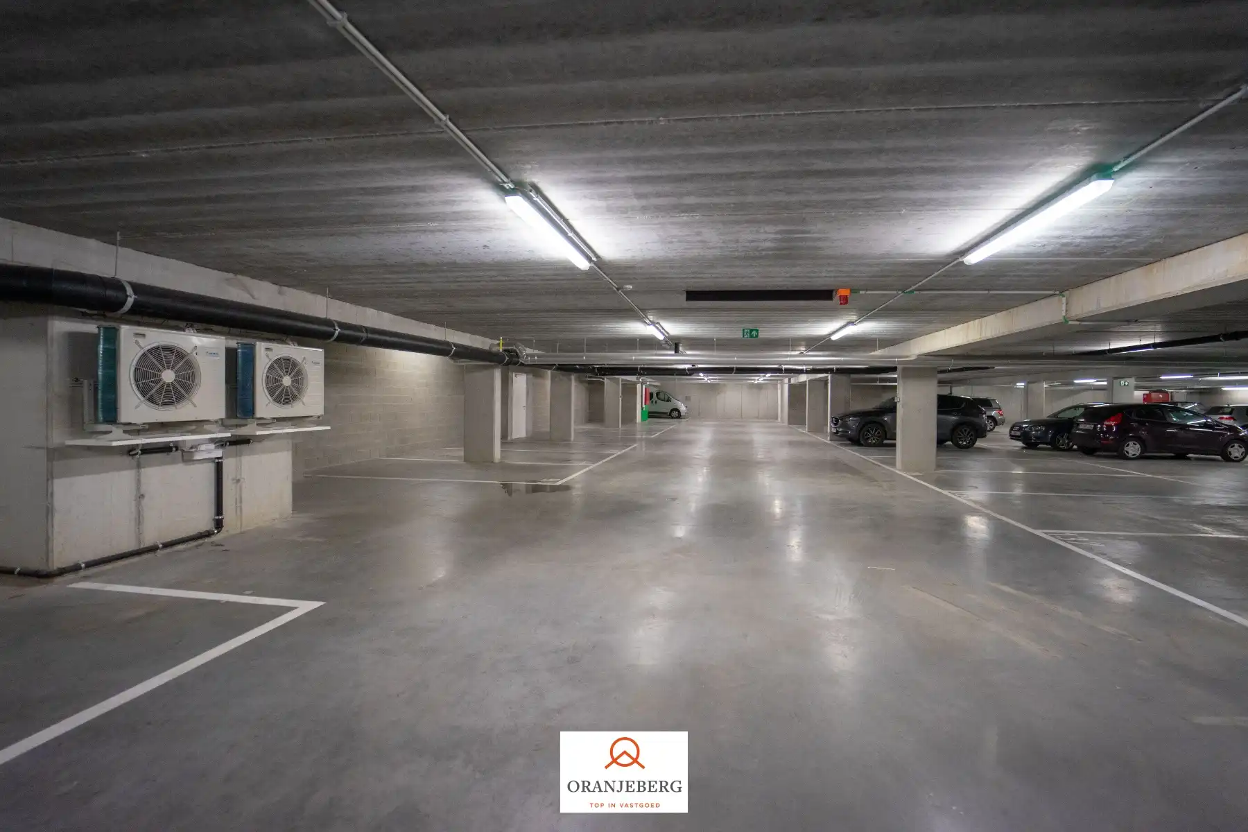Nieuwbouw autostaanplaats te huur in afgesloten parkeergarage nabij Gent centrum foto 4