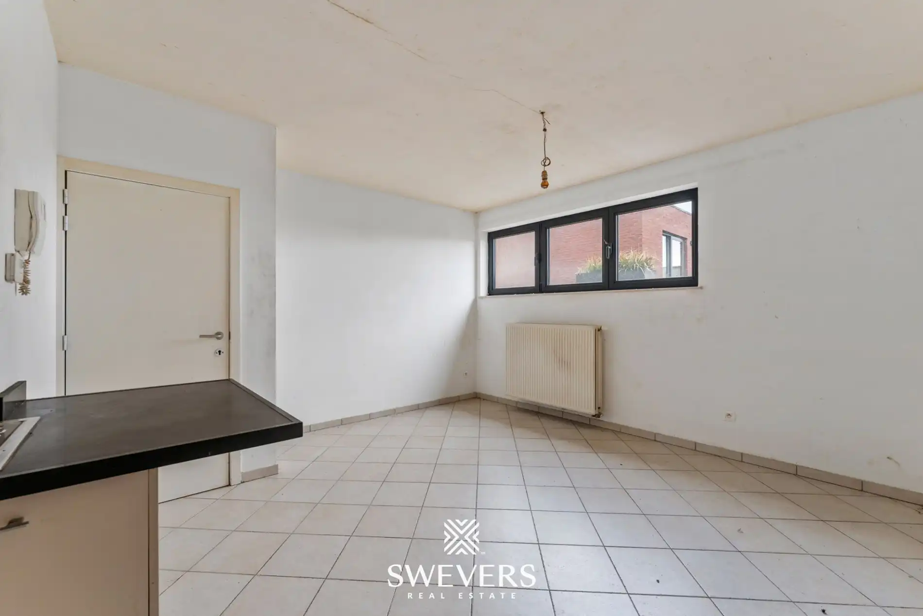 Centraal op te frissen appartement met potentieel in Halen foto 6