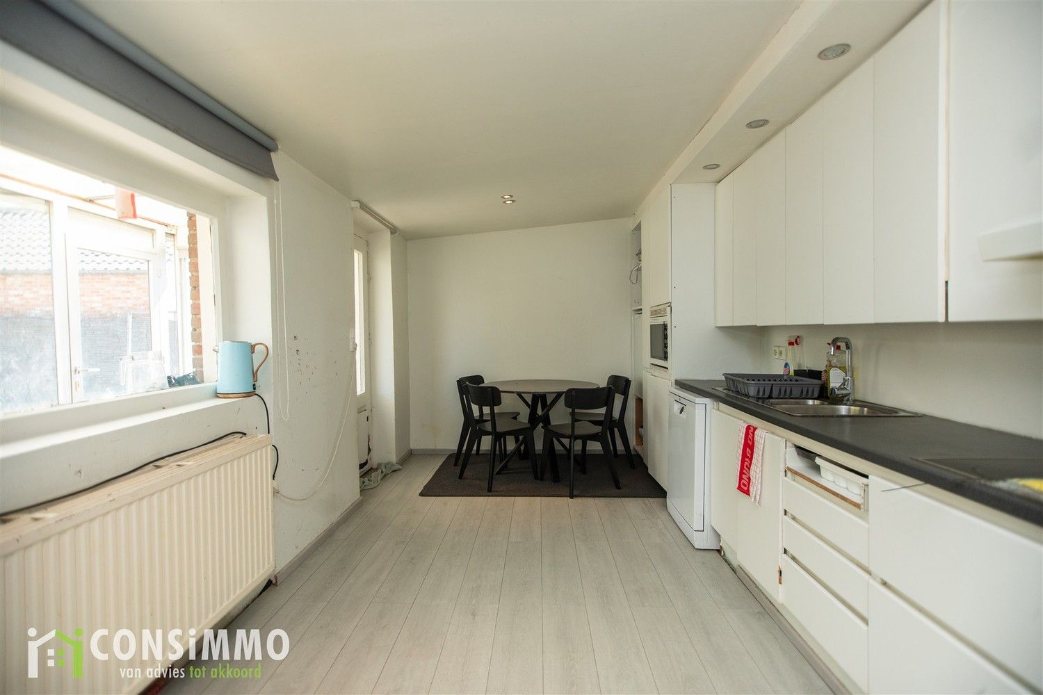 Gelijkvloerse woning met veel potentieel - vergunde nieuwbouwmogelijkheid in Genk foto 8