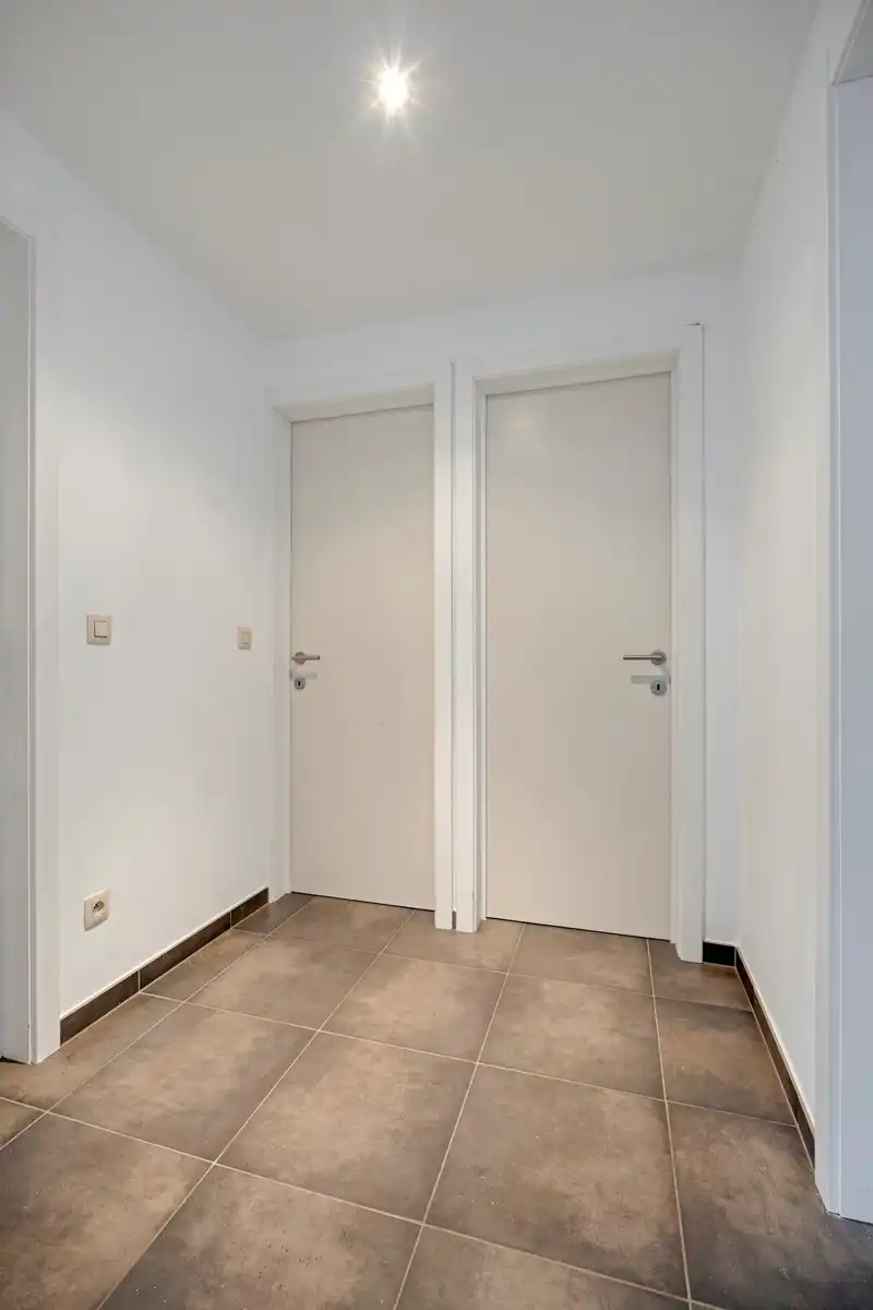 Energiezuinig appartement + autostaanplaats + kelder-berging foto 13