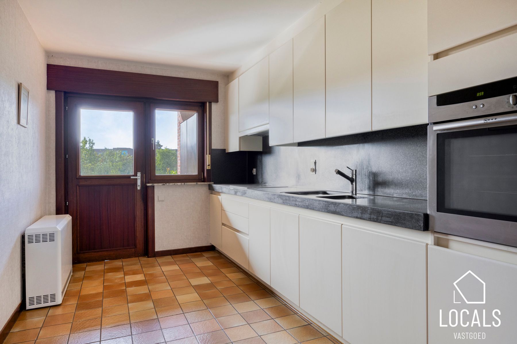 Gelijkvloers appartement met tuin foto 9