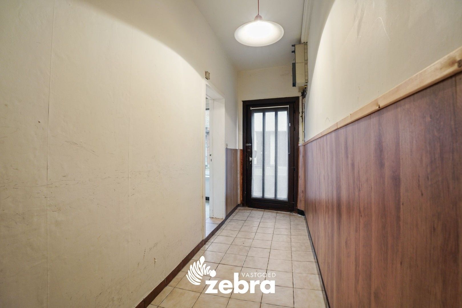 Deels gerenoveerde woning met twee slaapkamers te centrum Tielt! foto 2